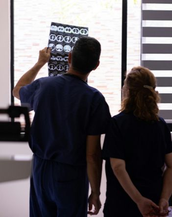 Two accredited colombian doctors viewing a patient's X-Ray