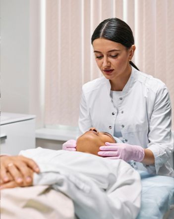 Plastic surgeon marking patient’s nose before rhinoplasty in Medellín.